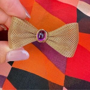 Bow Tie Pin with Purple Lucite Cabochon Jewel in Gold Tone Mesh